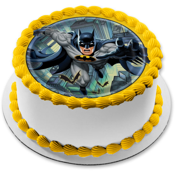 Imagen de decoración comestible para tarta con borde redondo amarillo de Batman volando sobre la ciudad ABPID01391