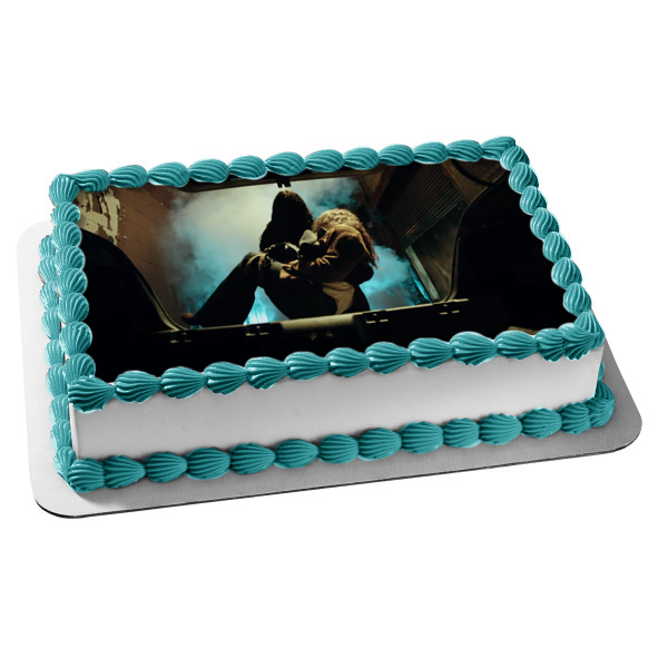 Malignant Madison Mitchell Being Put In a Car Trunk Edible Cake Topper Image ABPID54746